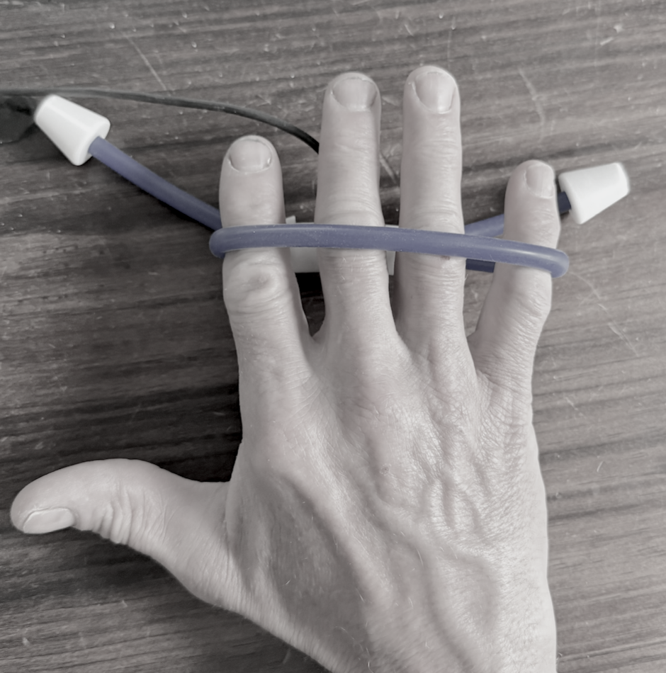 Splayometer hand loop in use, for whole hand interocceous strength measurement.